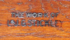 Branded signature "The Work of L & J G Stickley" on back of rear stretcher.